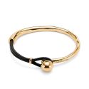 PULSERA UNODE50 SER INTRÉPIDA CUERO Y METAL CHAPADO ORO 